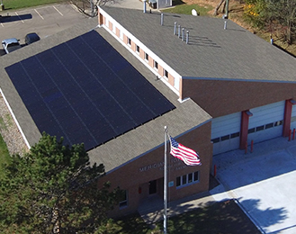 Solar panels on top of the fire station building.