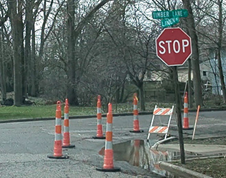 Cones placed at street corner because of flooding