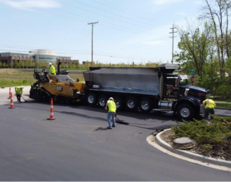 Photo of construction workers paving for the Local Roads Program