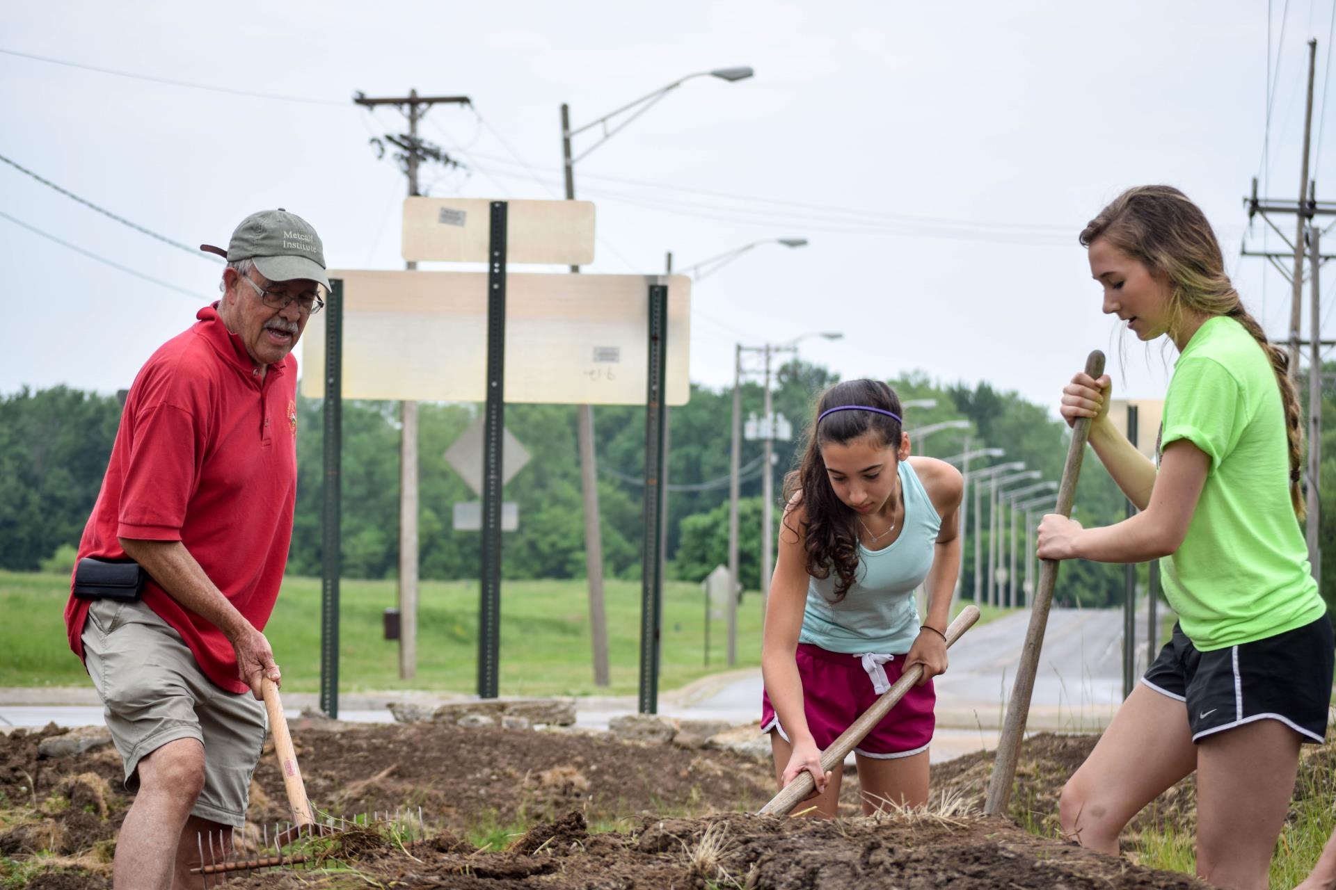 Community Gardens Volunteers working on a garden patch