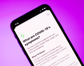 Graphic of a cellphone with a page on COVID-19 information